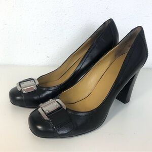 Nine West black heels with silver buckle.